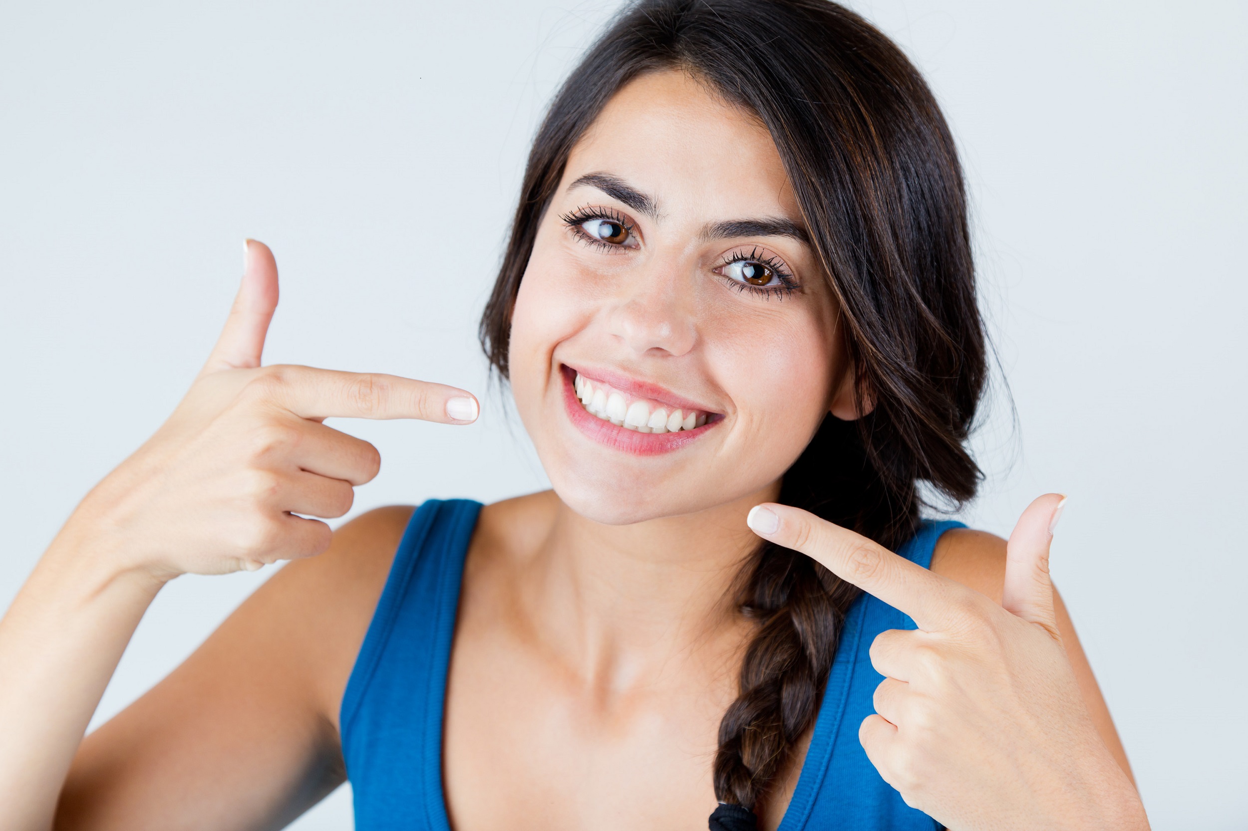 Girl smiling after geetting teeth whitening in Winnipeg